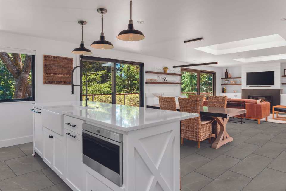 concrete look luxury vinyl tile in modern farmhouse open concept living kitchen